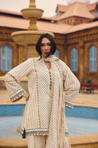 Model in the Coconut Sorbet ivory polka-dot kurta with tribal-print borders