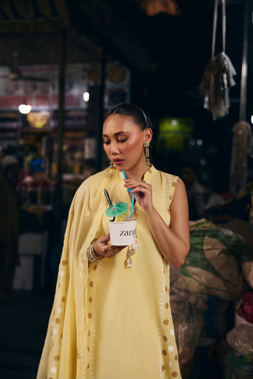 Model in the Lemon Meringue long yellow kurta with gold polka dots