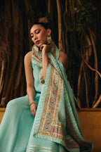 Model seated in Mermaid Majesty, the block-printed silk dupatta with gotta and sequin accents